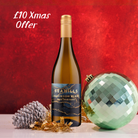 Bottle of Seahills Sauvignon Blanc with Christmas decorations on a red background
