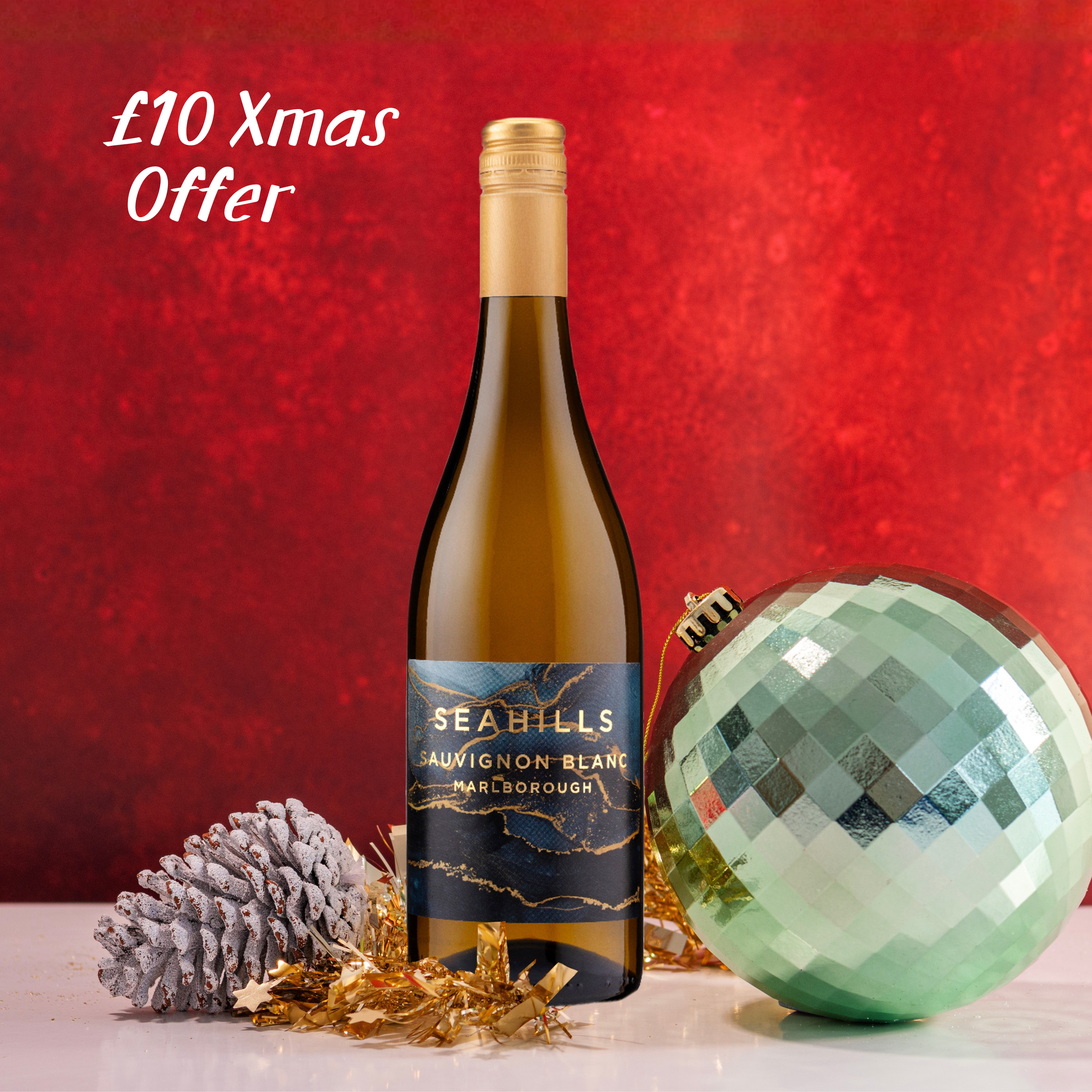 Bottle of Seahills Sauvignon Blanc with Christmas decorations on a red background