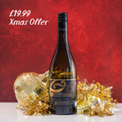 Bottle of Tohu Sauvignon Blanc with gold decorative elements on a red background, featuring a Christmas offer.